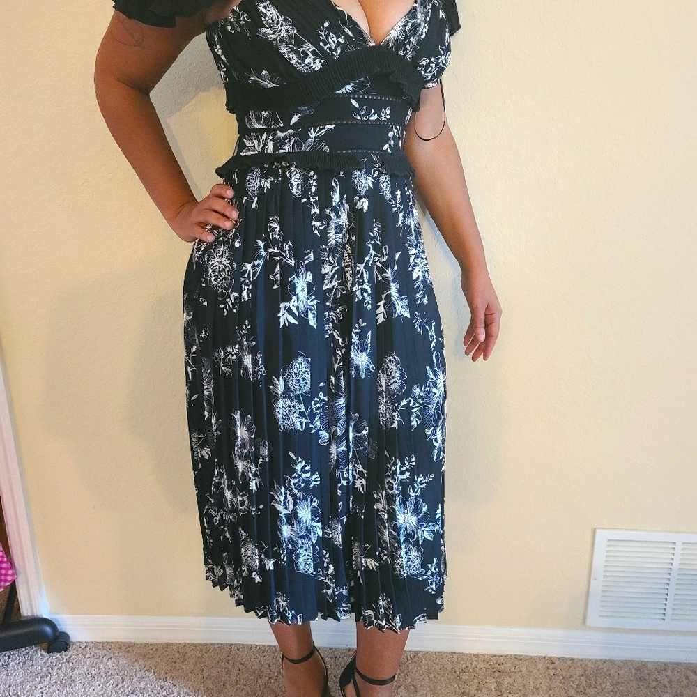 Floral dress with shoulder detail.